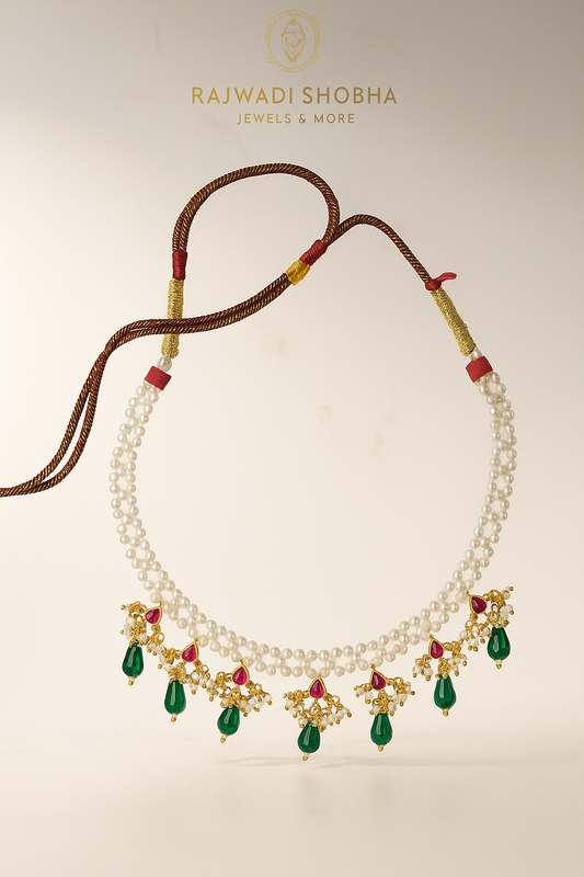 Necklace featuring green and white pearls interspersed with red beads, designed as artificial jewelry