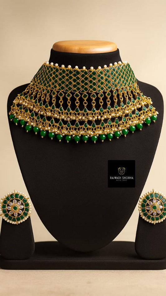 A green and gold jadau rani haar necklace with matching earrings