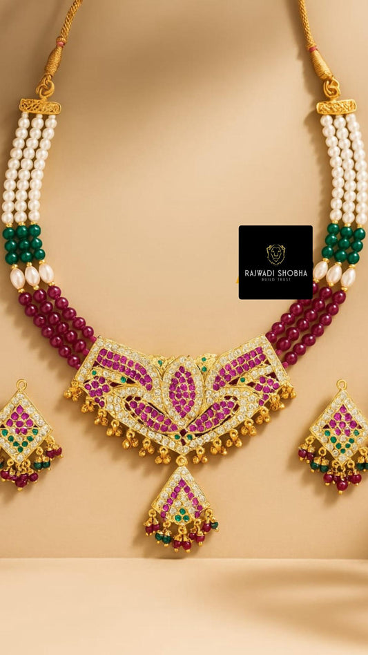 A stunning Manak moti jadau necklace featuring pink and green stones, elegantly designed for a luxurious look.